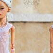 Tamikan Space Gal Kioni with Curious face, cyber leg, Stanced torso, Mediterranean skin tone from the front and behind